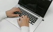 Free Hands on a Laptop Keyboard Stock Photo